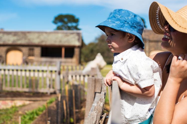 Mother and child looking at community garden at Werribee Park